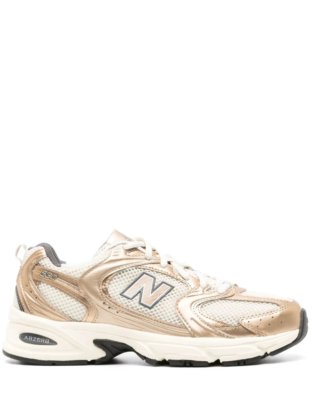 New Balance 530 tonalità oro